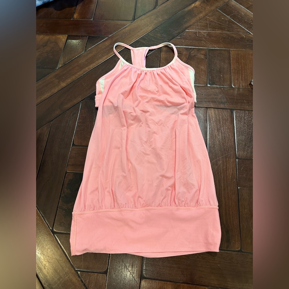 Lululemon pink tank with connected bra. Good condition. Size 4.